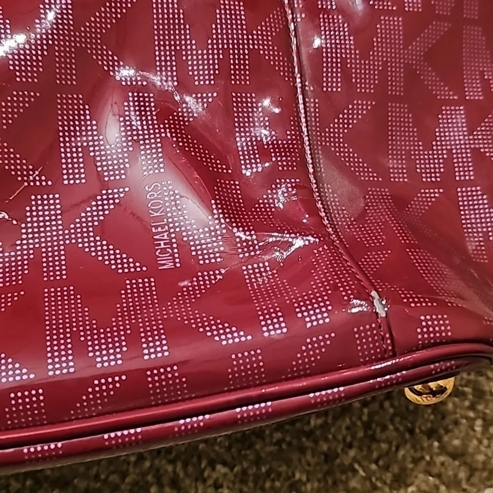 Red michael kors tote purse.